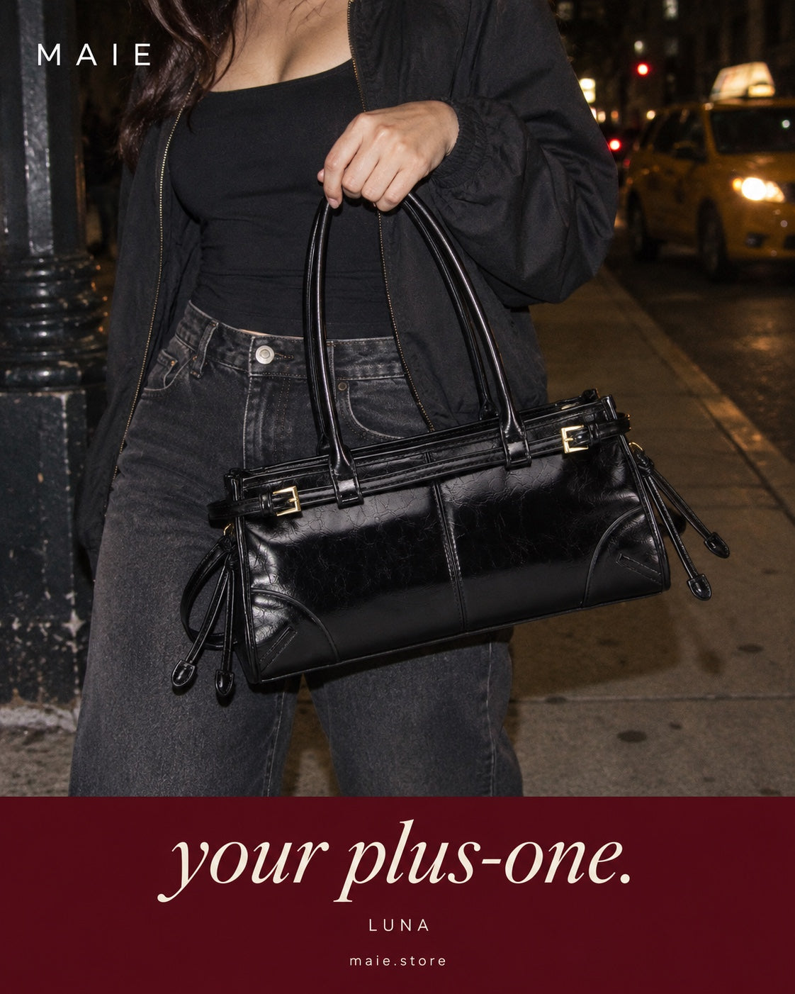 Luna black shoulder bag styled for a night in the city. Your plus-one.