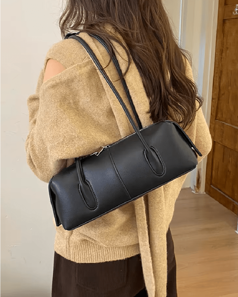 Mira Cylinder Shoulder Bag in black – styled look