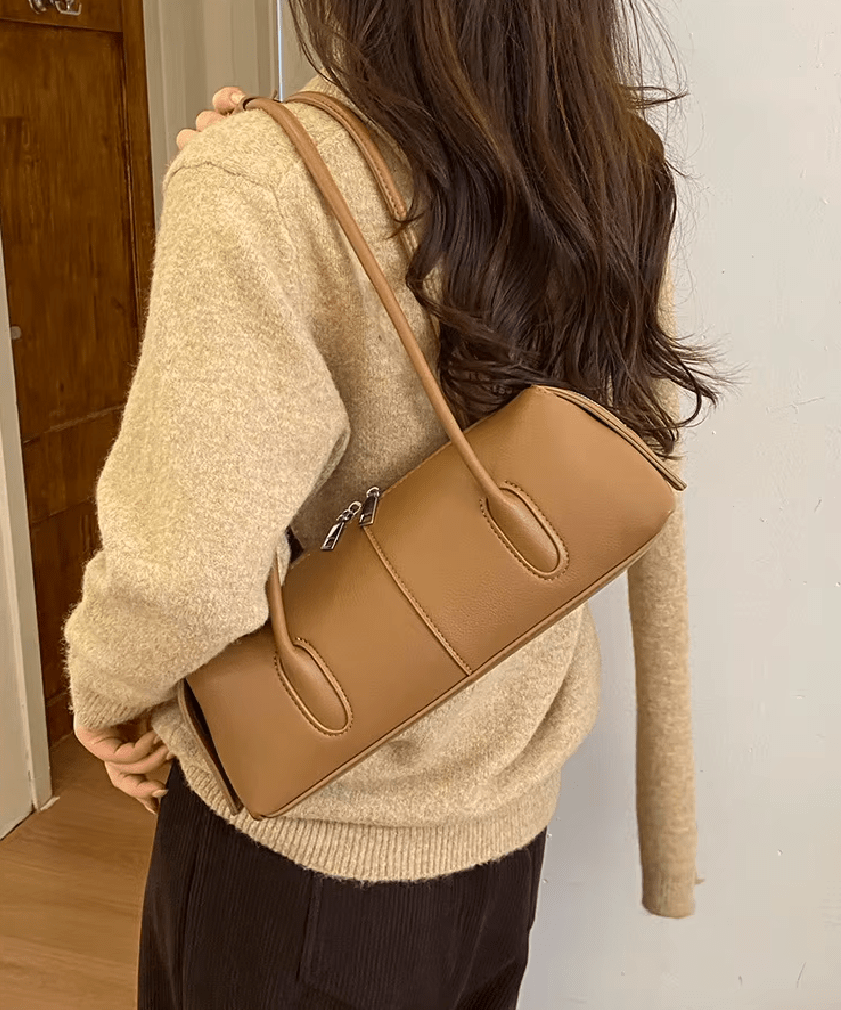 Mira Cylinder Shoulder Bag in tan – styled look