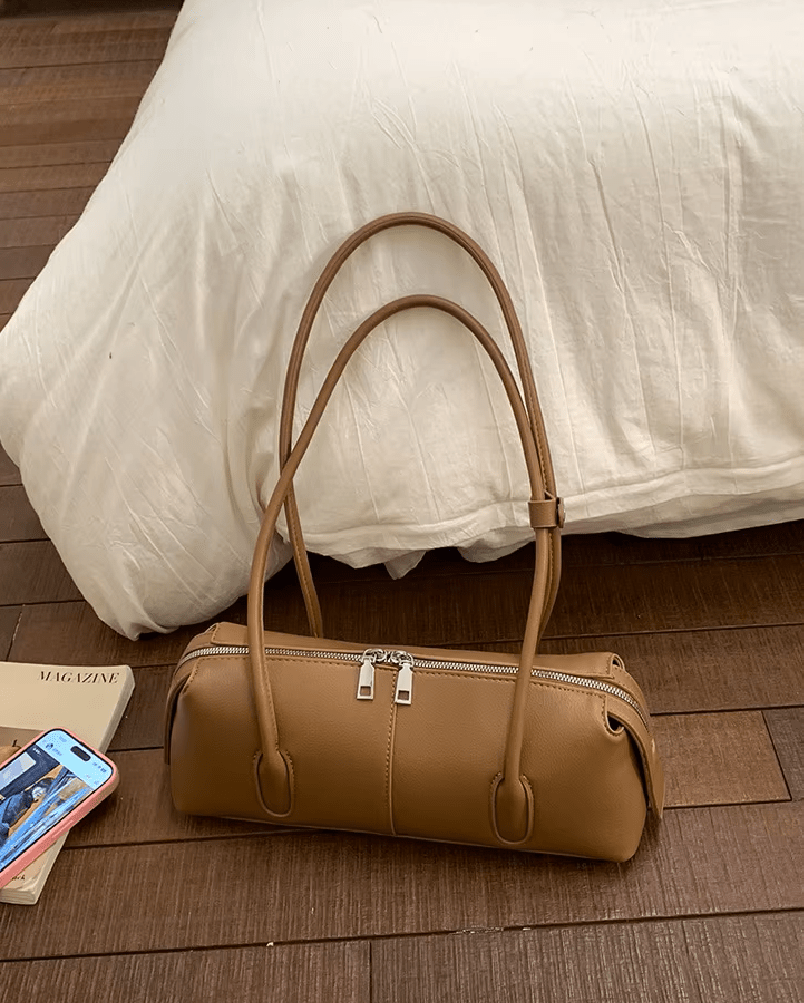 Mira Cylinder Shoulder Bag in tan – styled look